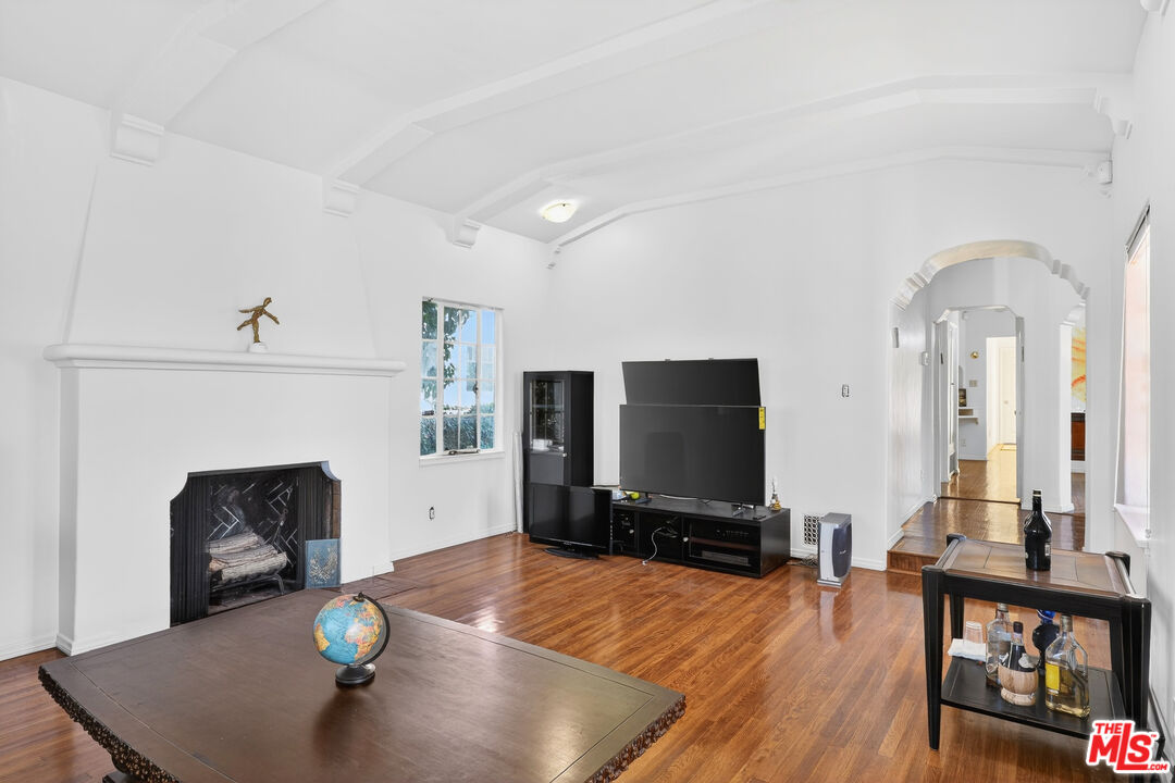 1544 South Point View Street Los Angeles, CA 90035 - Photo 16 of 67 a living room with furniture and a fireplace