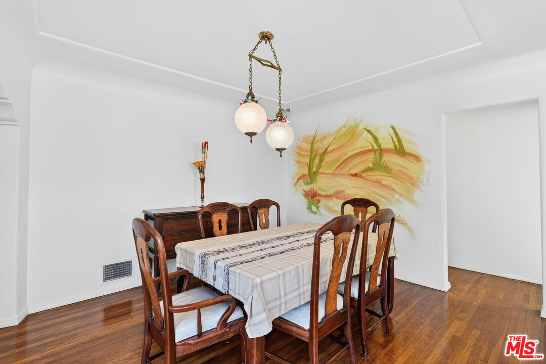 1544 South Point View Street Los Angeles, CA 90035 - Photo 18 of 67 a dining room with furniture and wooden floor