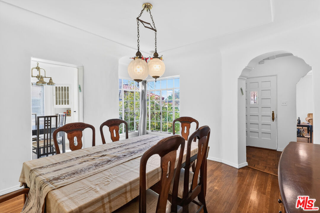 1544 South Point View Street Los Angeles, CA 90035 - Photo 20 of 67 a view of a dining room with furniture window and wooden floor