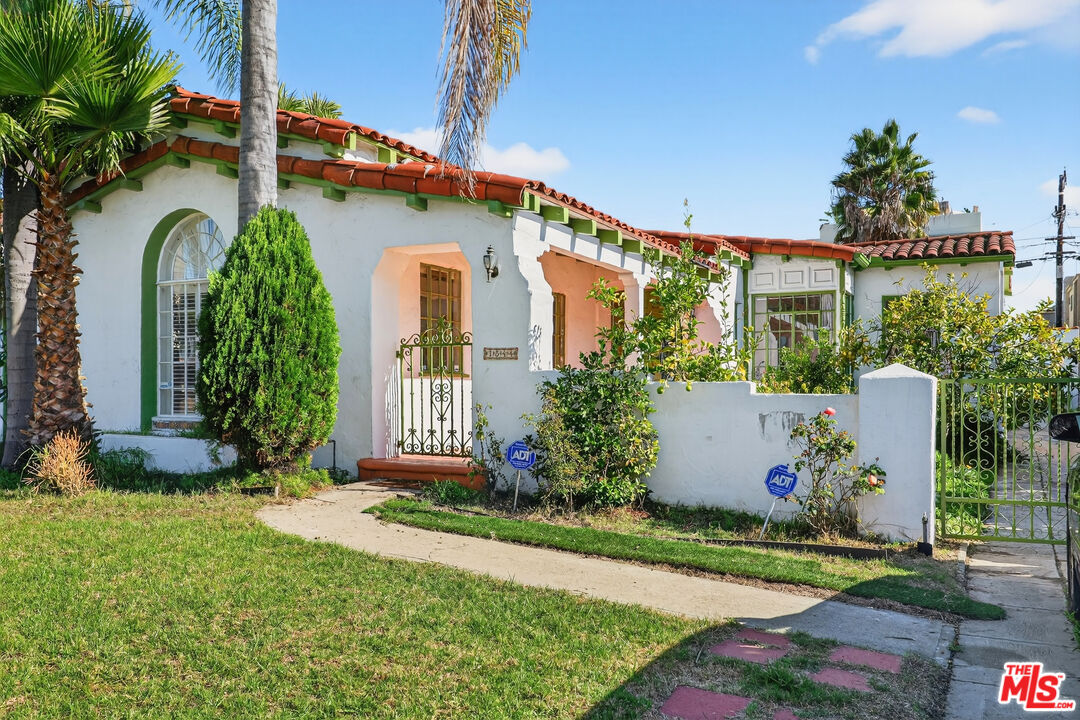 1544 South Point View Street Los Angeles, CA 90035 - Photo 2 of 67 a front view of a house with garden