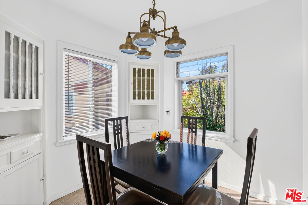 1544 South Point View Street Los Angeles, CA 90035 - Photo 23 of 67 a view of a dining room with furniture window and outside view