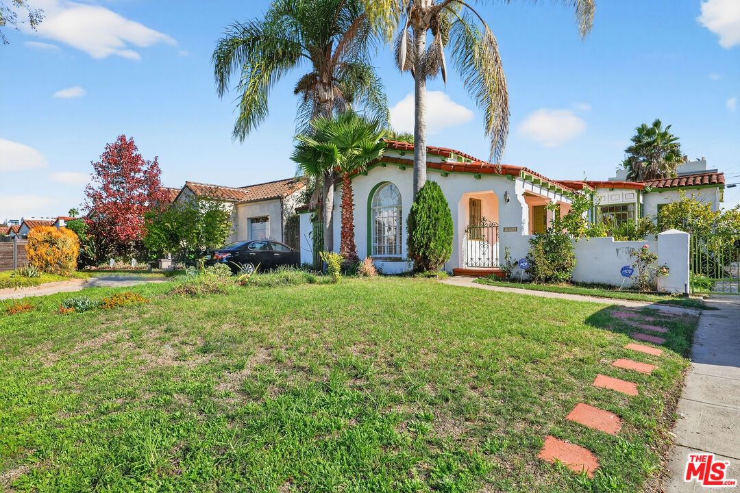 1544 South Point View Street Los Angeles, CA 90035 - Photo 3 of 67 a front view of house with yard and outdoor space