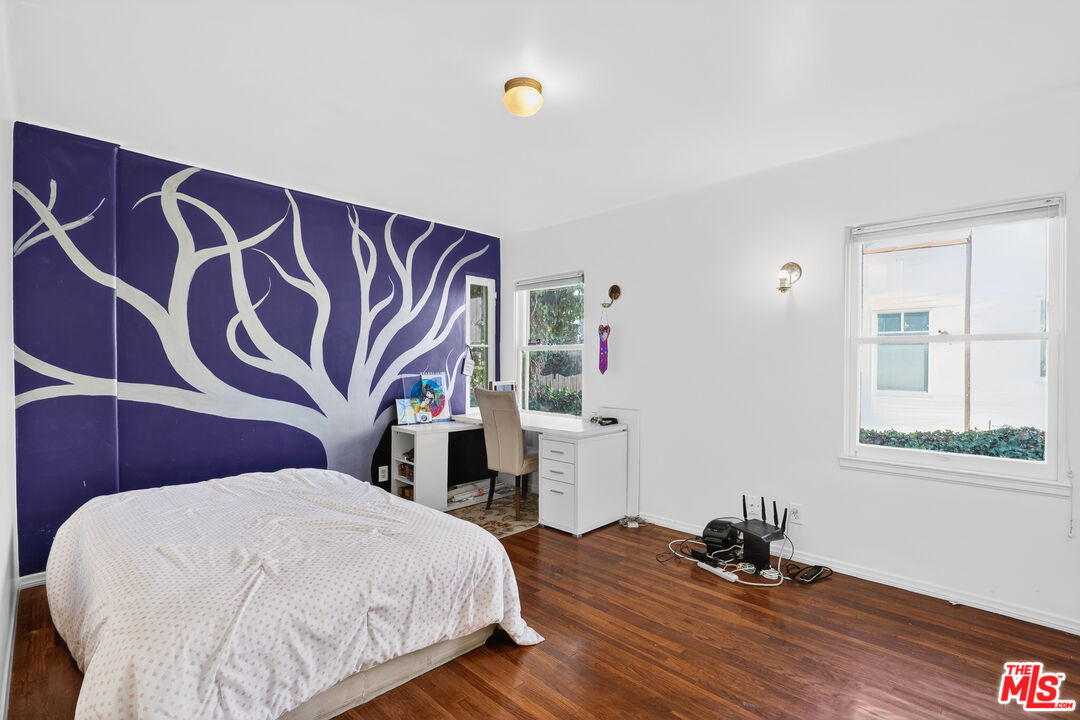 1544 South Point View Street Los Angeles, CA 90035 - Photo 34 of 67 a bedroom with a bed and a window