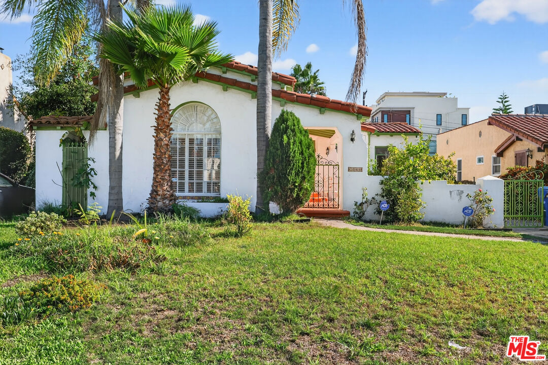 1544 South Point View Street Los Angeles, CA 90035 - Photo 4 of 67 a front view of a house with garden