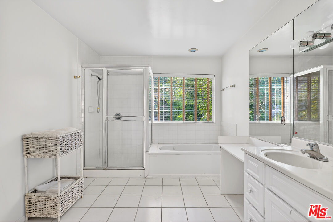 1544 South Point View Street Los Angeles, CA 90035 - Photo 41 of 67 a bathroom with a sink a toilet and shower