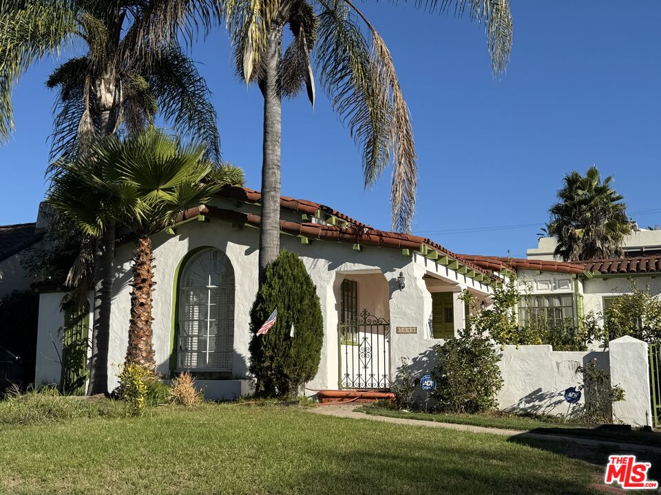 1544 South Point View Street Los Angeles, CA 90035 - Photo 5 of 67 a front view of a house with a yard