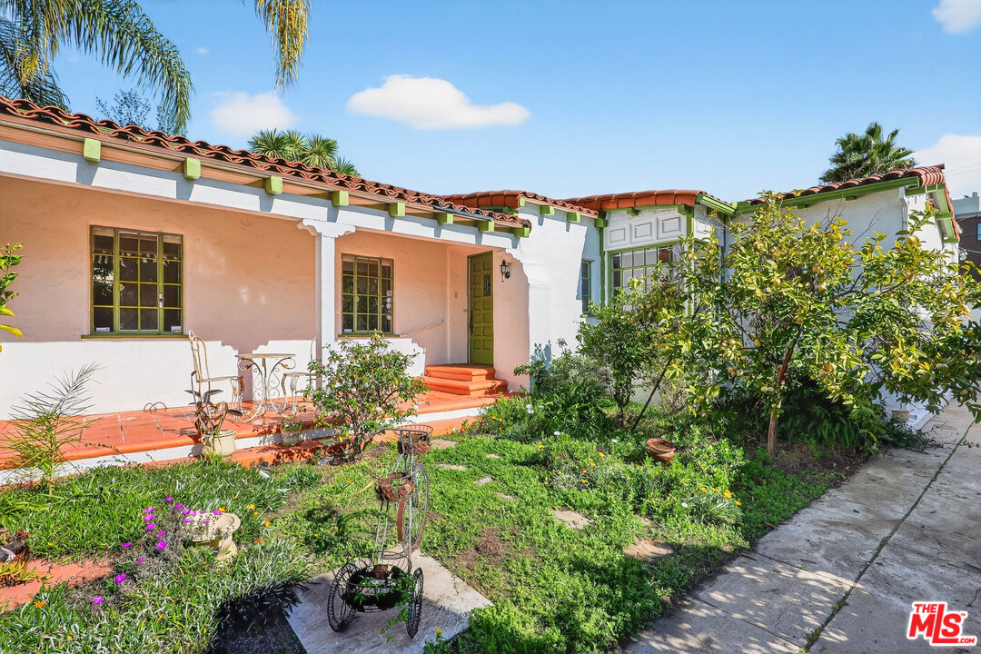 1544 South Point View Street Los Angeles, CA 90035 - Photo 56 of 67 a front view of a house with a yard