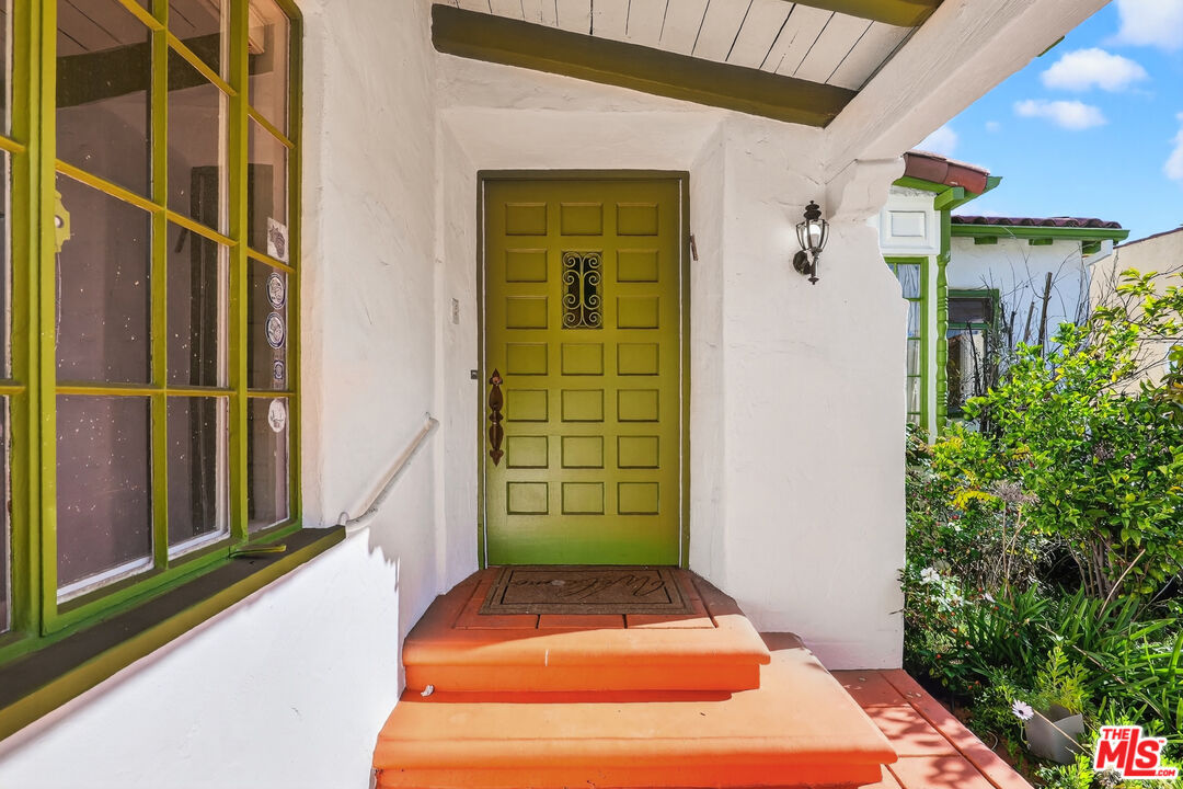 1544 South Point View Street Los Angeles, CA 90035 - Photo 9 of 67 a front view of a house with a yard