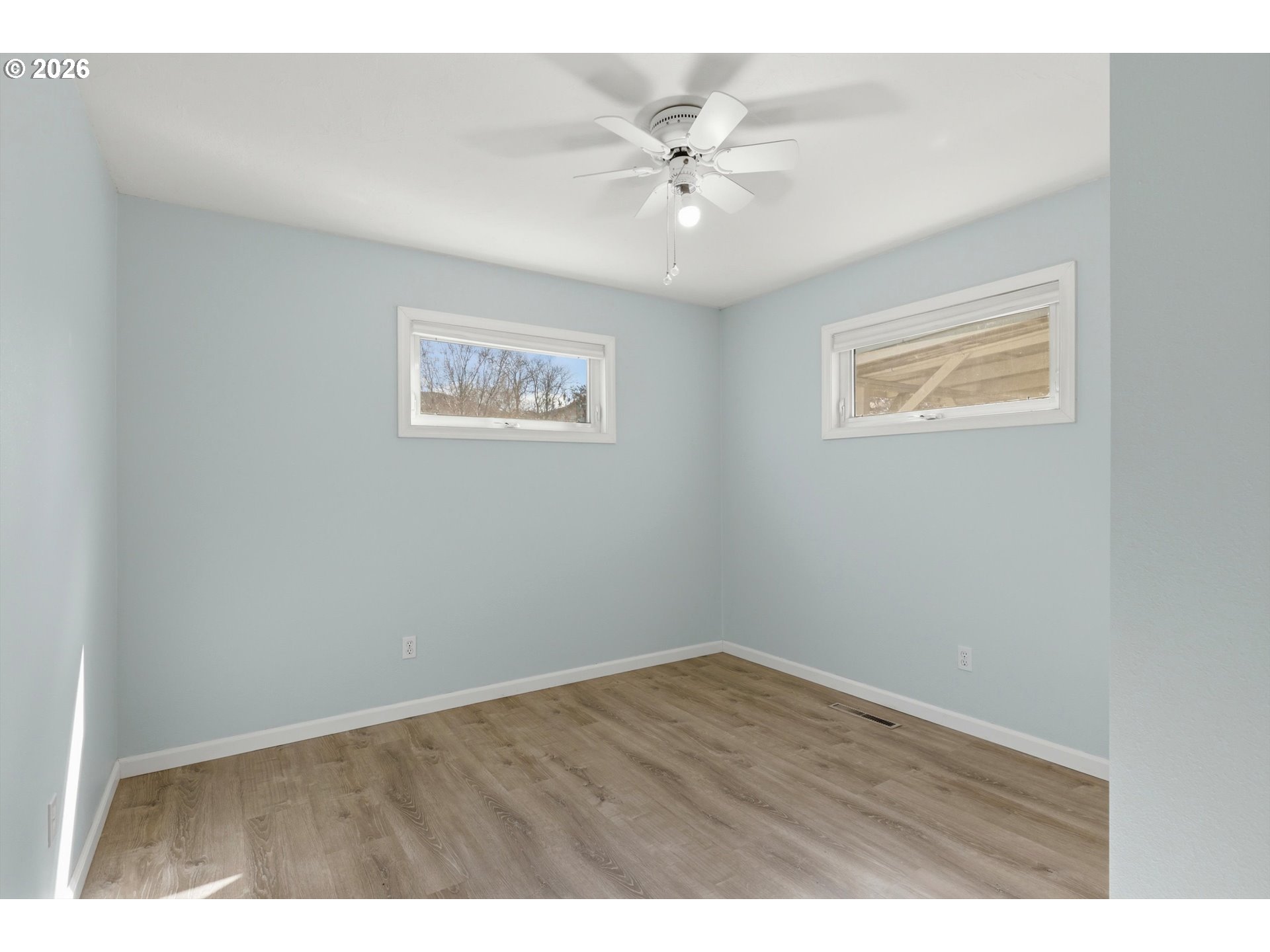 1829 East 8th Street The Dalles, OR 97058 - Photo 16 of 48 a view of an empty room with a window
