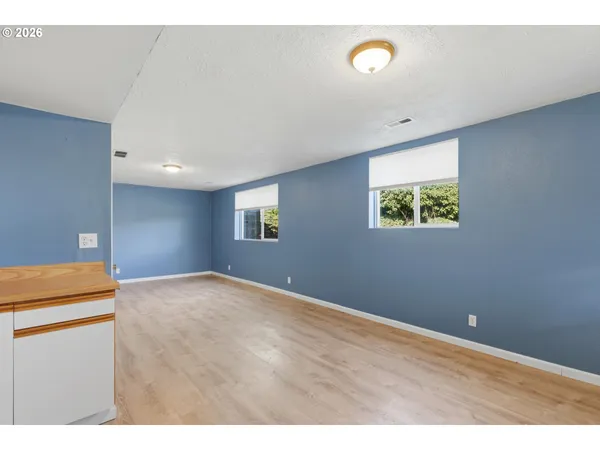 a view of an empty room with a window