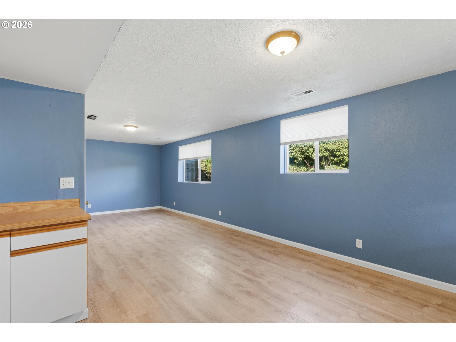 1829 East 8th Street The Dalles, OR 97058 - Photo 20 of 48 a view of an empty room with a window