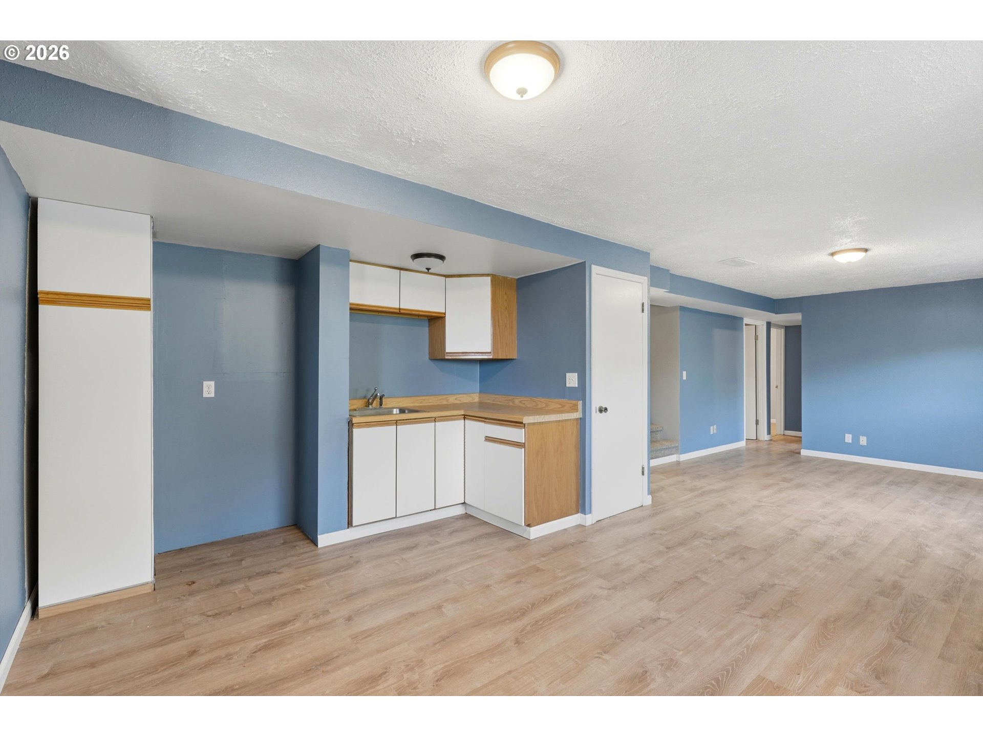 1829 East 8th Street The Dalles, OR 97058 - Photo 23 of 48 a view of a kitchen with a sink and a refrigerator