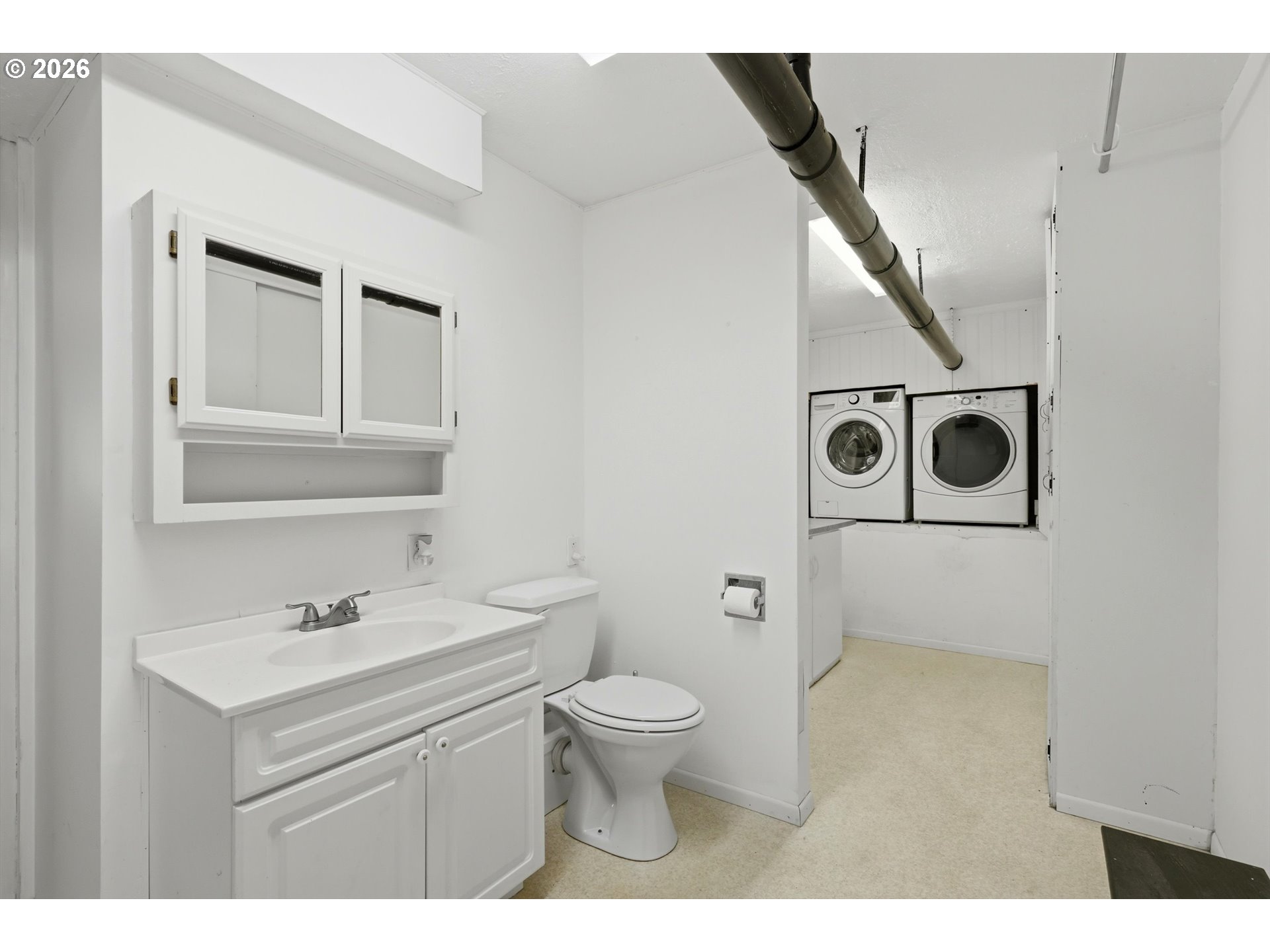 1829 East 8th Street The Dalles, OR 97058 - Photo 28 of 48 a bathroom with a sink a toilet and a mirror