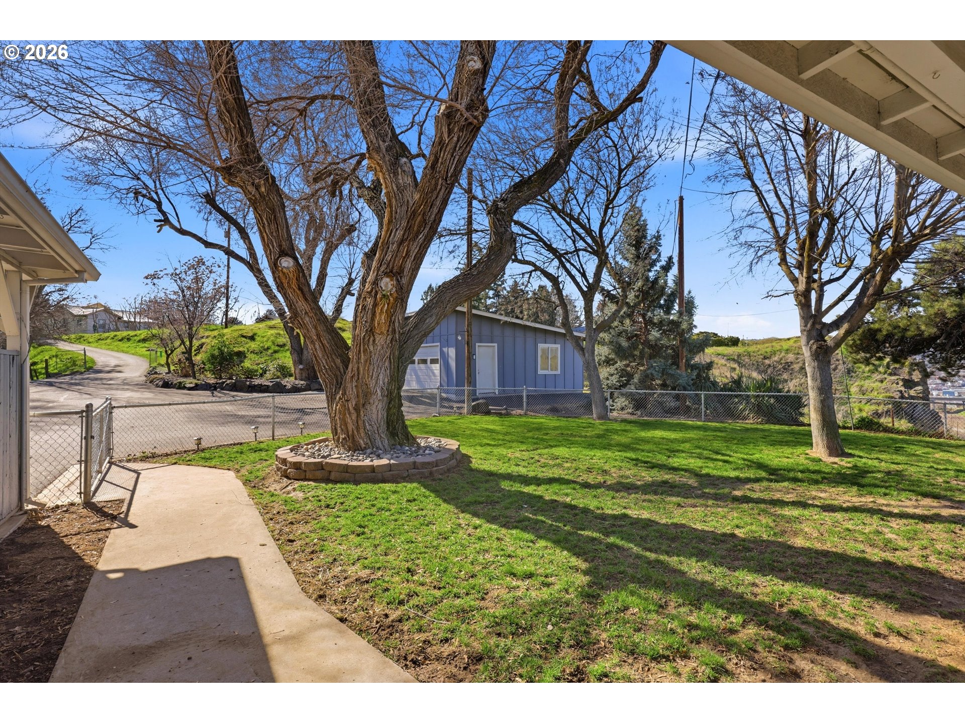 1829 East 8th Street The Dalles, OR 97058 - Photo 30 of 48 a view of a house with a yard