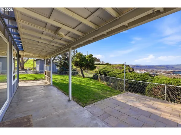 a view of a porch with a big yard