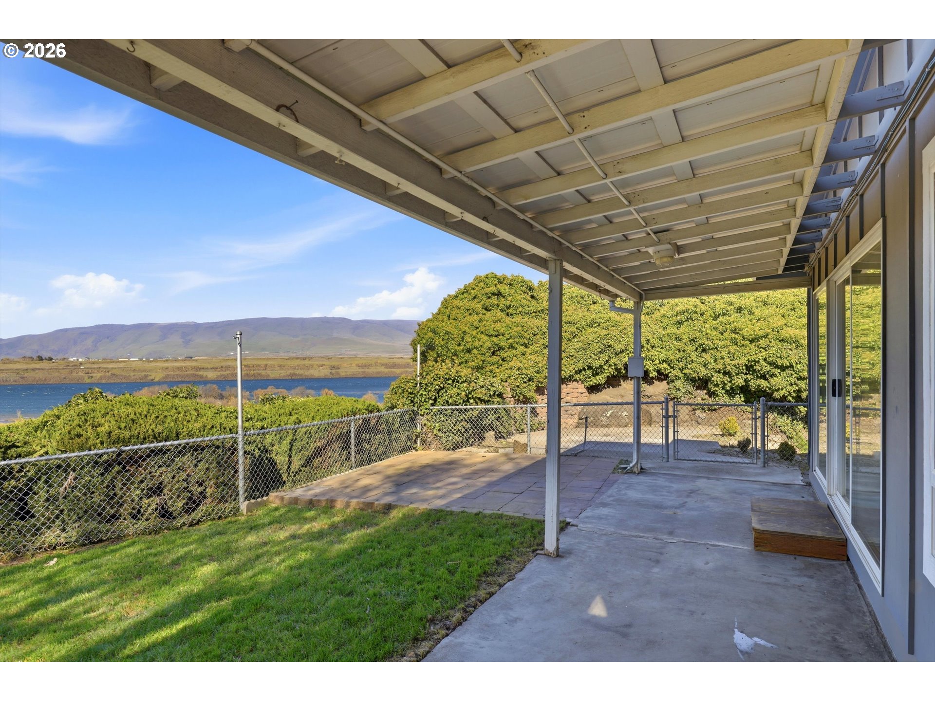 1829 East 8th Street The Dalles, OR 97058 - Photo 33 of 48 a view of a porch with a big yard