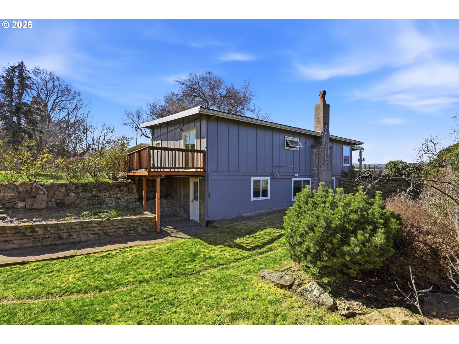 1829 East 8th Street The Dalles, OR 97058 - Photo 39 of 48 a view of a wooden house with a yard
