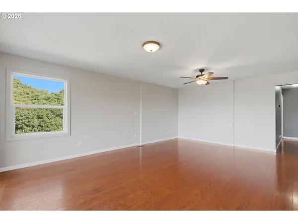 a view of an empty room with a window
