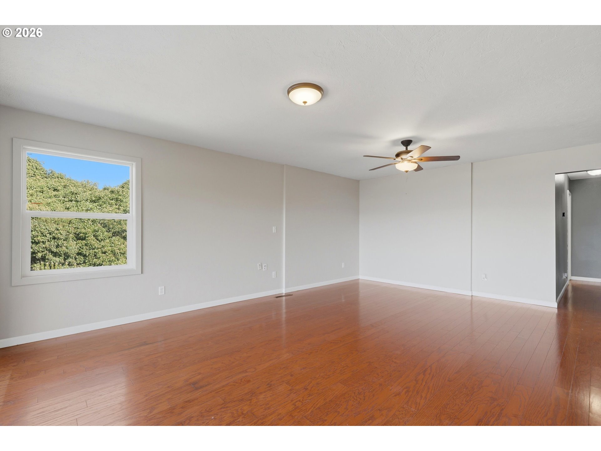 1829 East 8th Street The Dalles, OR 97058 - Photo 5 of 48 a view of an empty room with a window