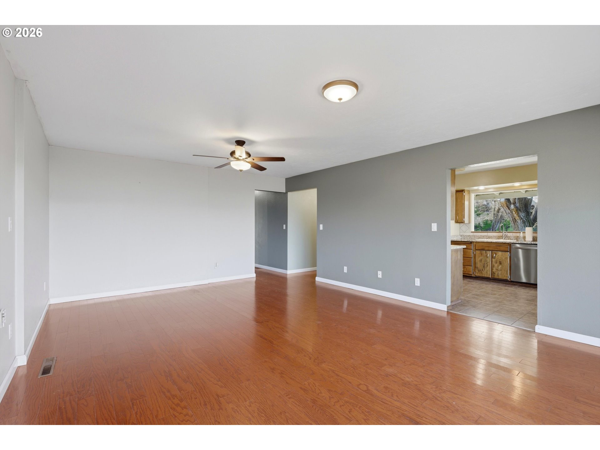 1829 East 8th Street The Dalles, OR 97058 - Photo 6 of 48 a view of an empty room with a window