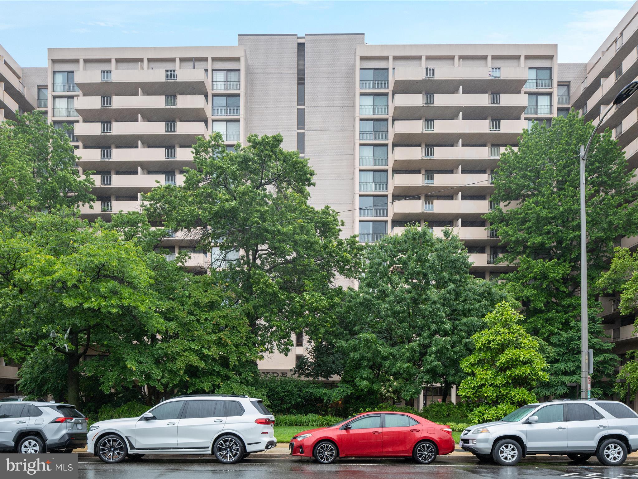 4141 North Henderson Road, Unit 809 Arlington, VA 22203 - Photo 20 of 21 a view of a cars parked in front of a building