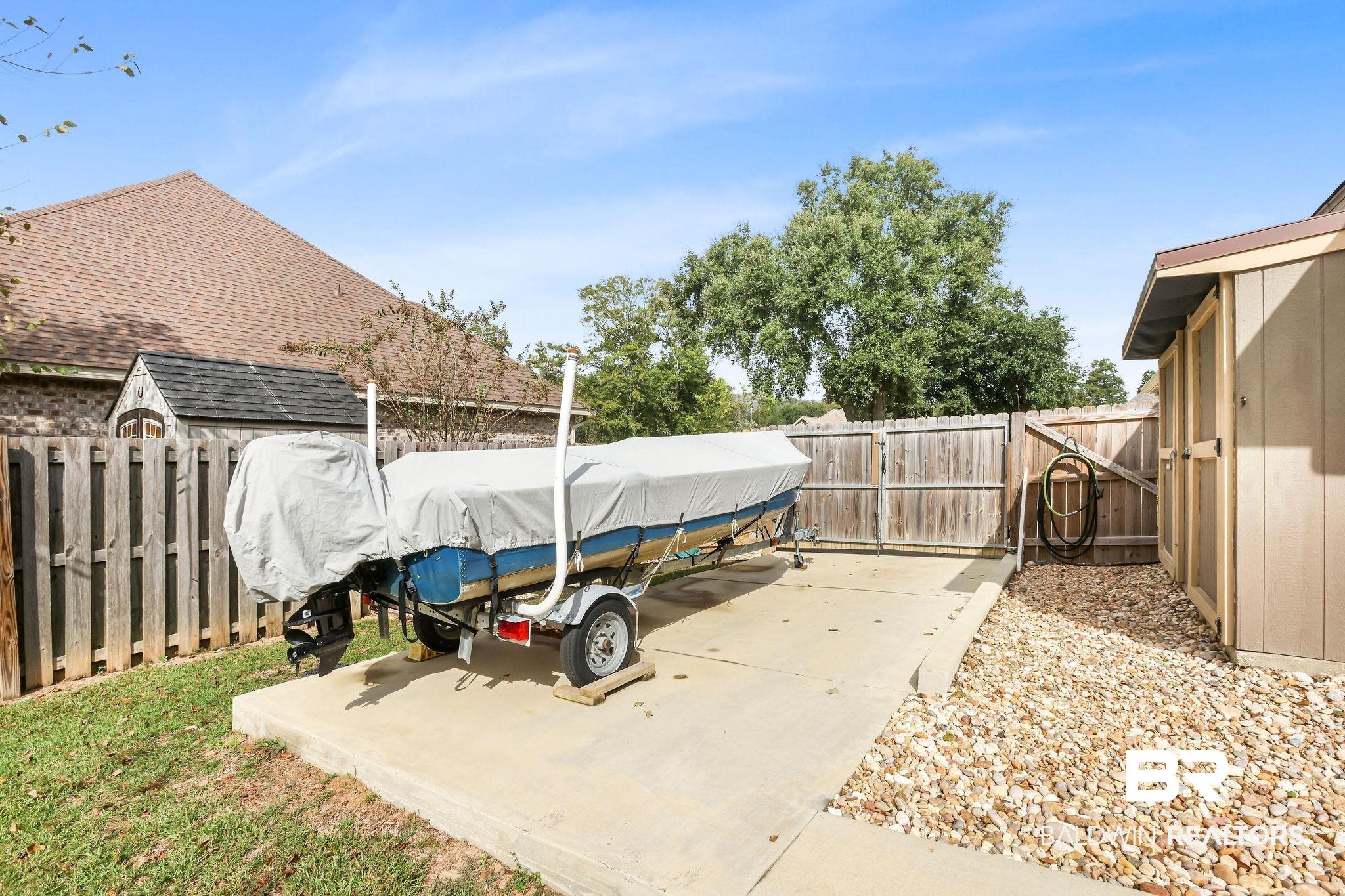1086 Destin Avenue Foley, AL 36535 - Photo 25 of 30 View of patio featuring a shed