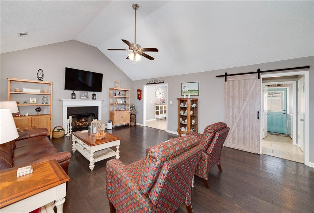 121 Harper Road McDonough, GA 30252 - Photo 13 of 38 a view of a livingroom with furniture a fireplace and wooden floor