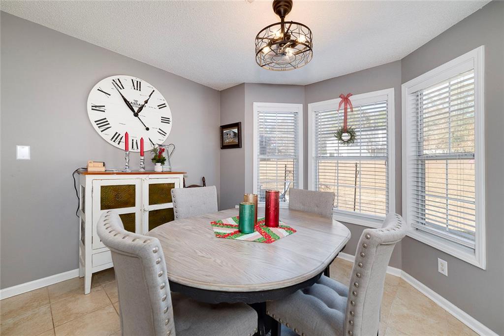 121 Harper Road McDonough, GA 30252 - Photo 20 of 38 a view of a dining room with furniture window and wooden floor