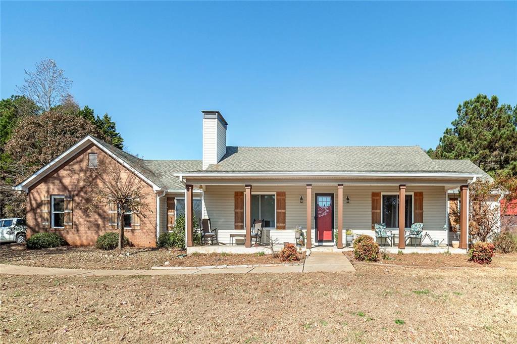 121 Harper Road McDonough, GA 30252 - Photo 2 of 38 a view of a house with a patio