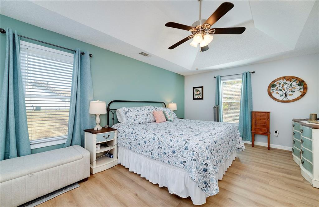 121 Harper Road McDonough, GA 30252 - Photo 25 of 38 a bedroom with a bed chandelier and a window