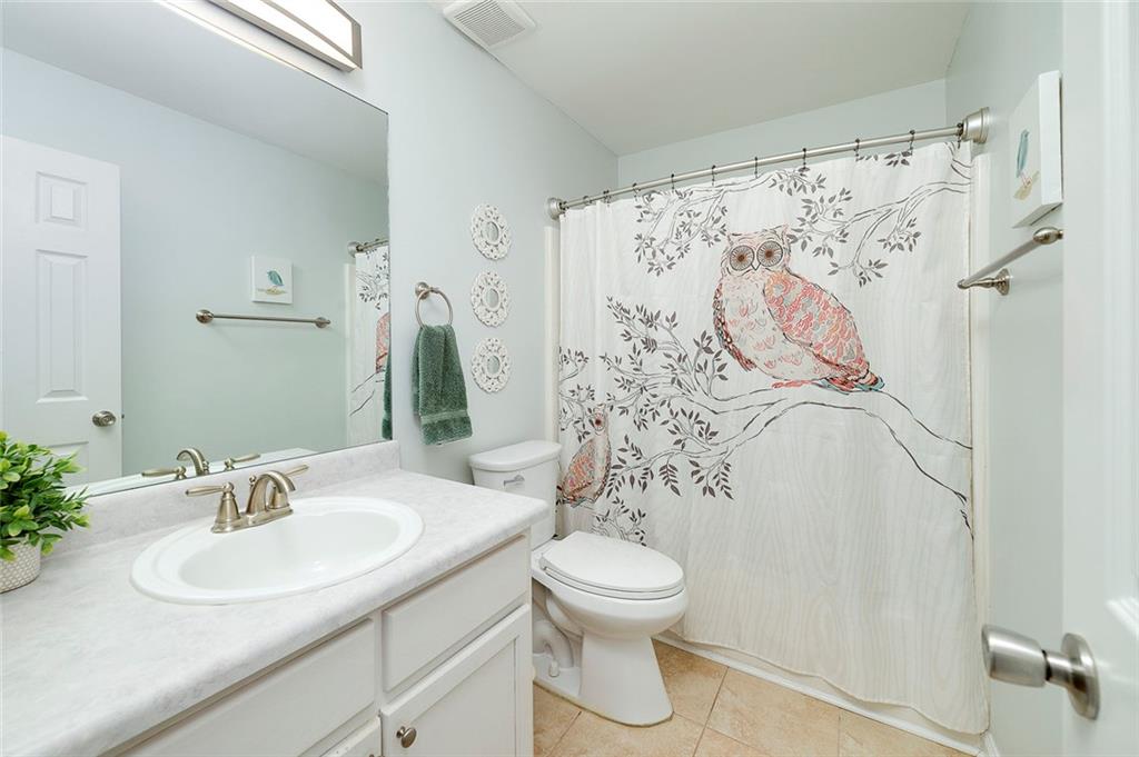 121 Harper Road McDonough, GA 30252 - Photo 32 of 38 a bathroom with a sink toilet and shower