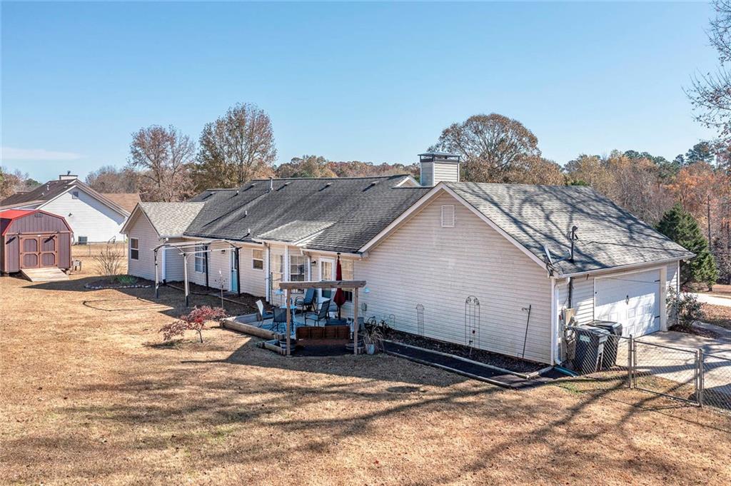 121 Harper Road McDonough, GA 30252 - Photo 36 of 38 a view of a house with snow on roof
