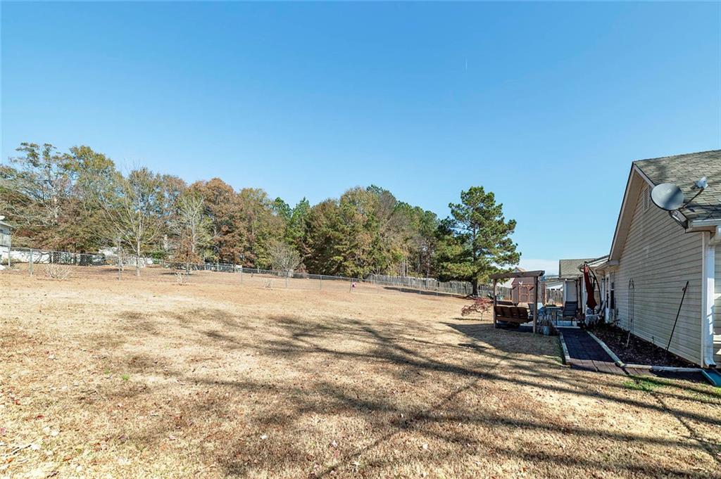 121 Harper Road McDonough, GA 30252 - Photo 5 of 38 a view of a backyard of the house