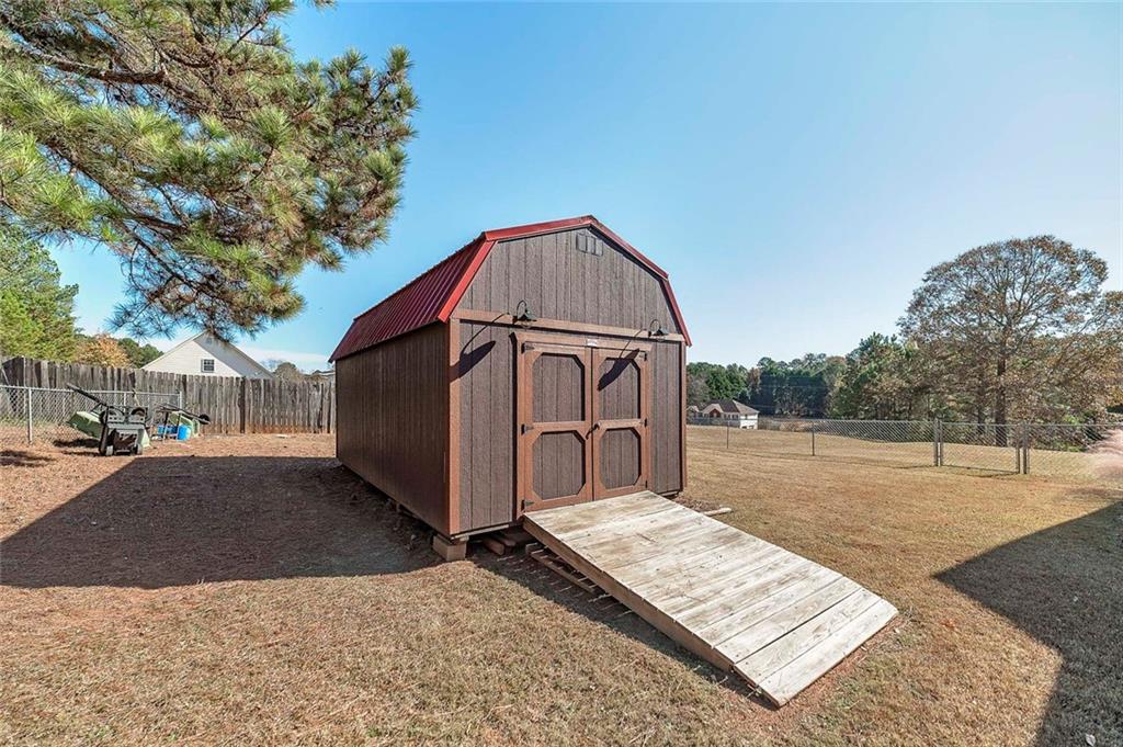 121 Harper Road McDonough, GA 30252 - Photo 7 of 38 a view of a backyard of the house
