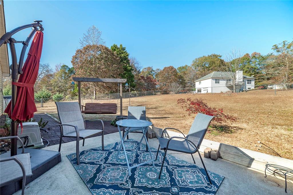 121 Harper Road McDonough, GA 30252 - Photo 8 of 38 a view of a terrace with furniture and a table