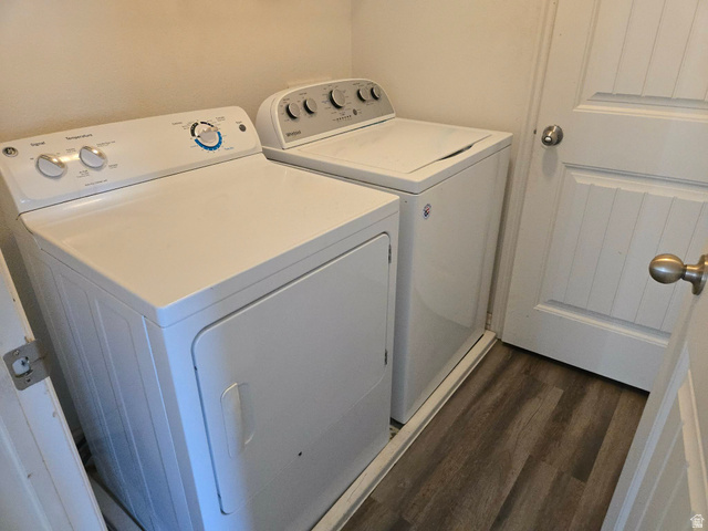 90 East Resaca Drive, Unit C11 Sandy, UT 84070 - Photo 18 of 27 Laundry area with washer and clothes dryer and dark wood-style floors