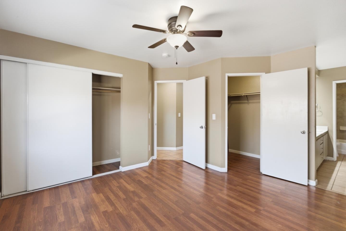 449 Sage Court Soledad, CA 93960 - Photo 12 of 17 an empty room with wooden floor and ceiling fan