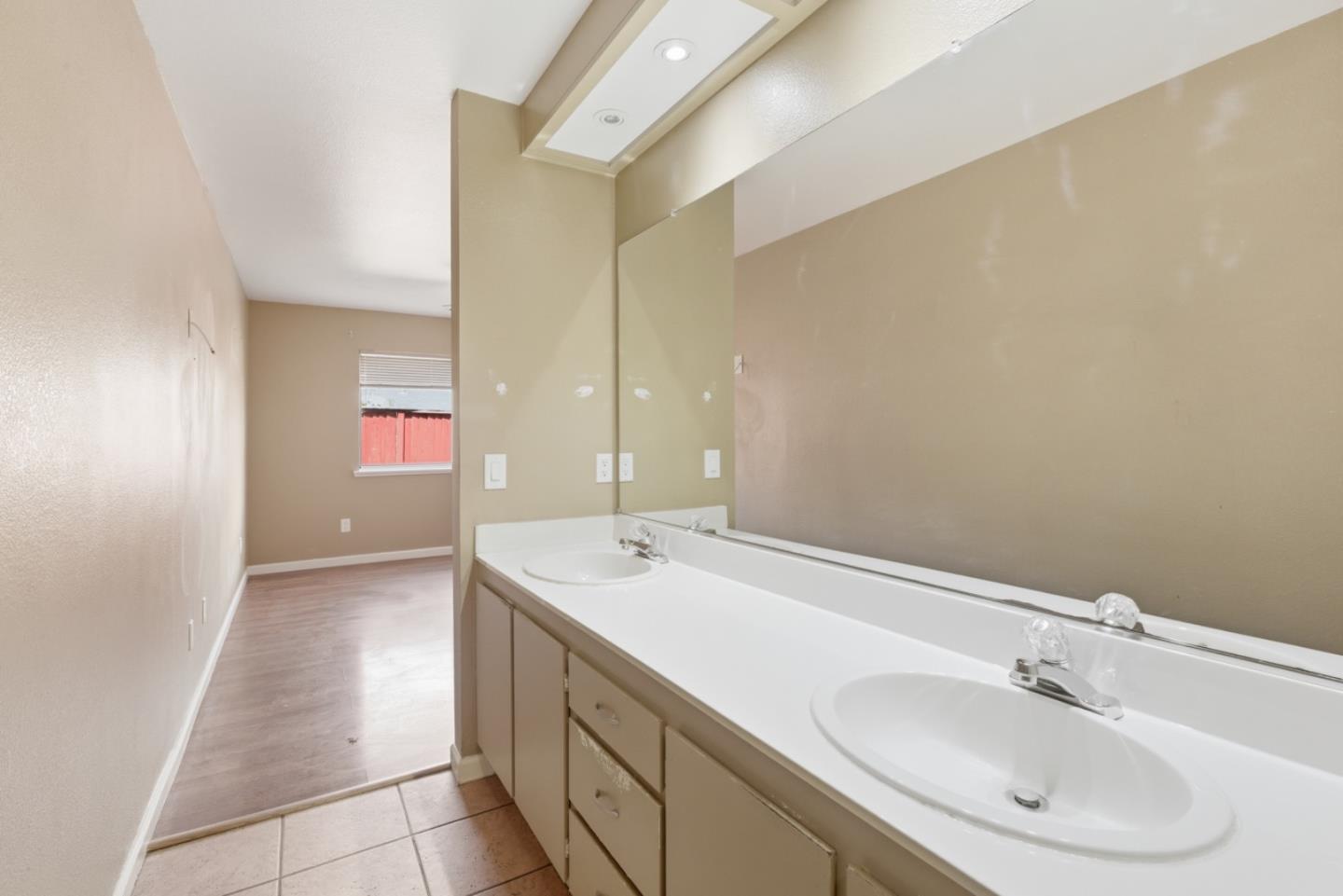 449 Sage Court Soledad, CA 93960 - Photo 14 of 17 a bathroom with a sink and a mirror