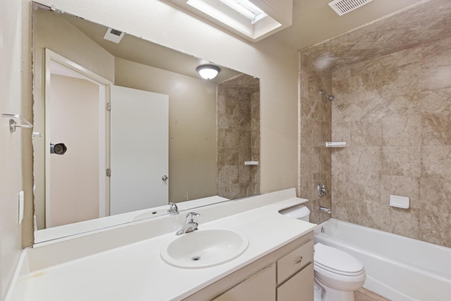449 Sage Court Soledad, CA 93960 - Photo 15 of 17 a bathroom with a sink toilet tub and shower