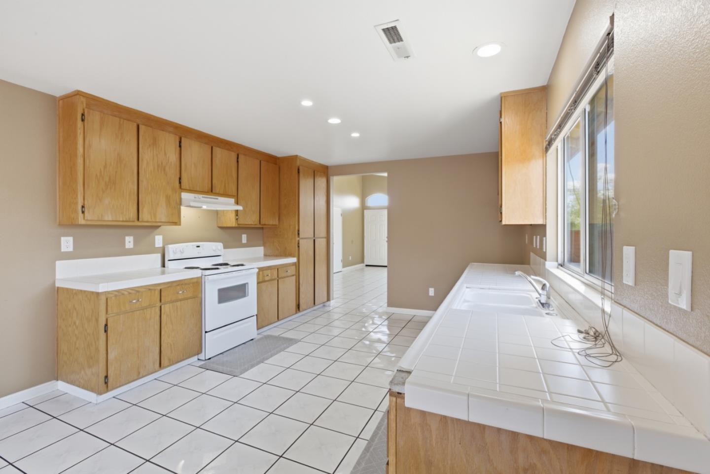 449 Sage Court Soledad, CA 93960 - Photo 5 of 17 a kitchen with a sink cabinets and window