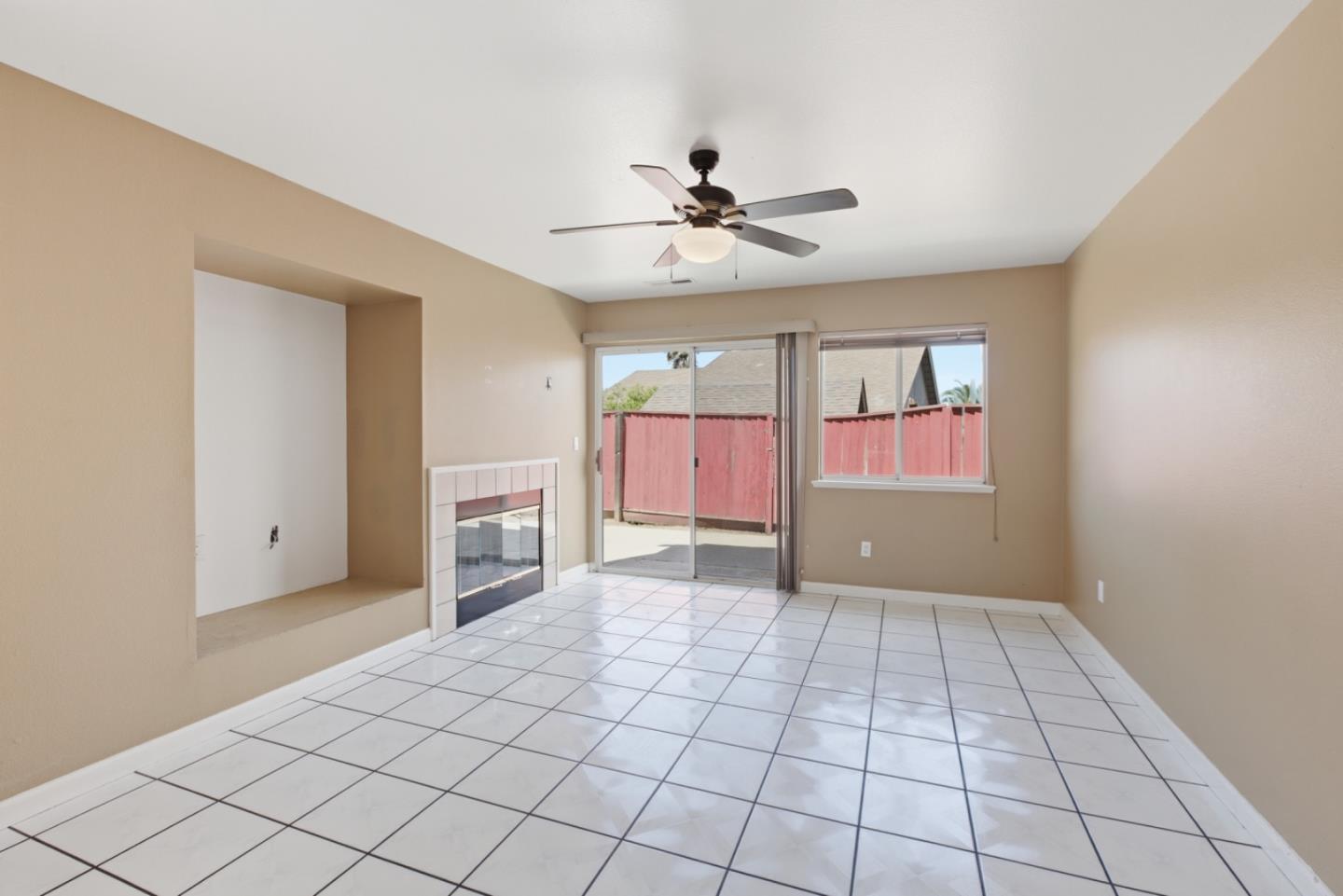 449 Sage Court Soledad, CA 93960 - Photo 7 of 17 a view of an empty room with window and chandelier fan