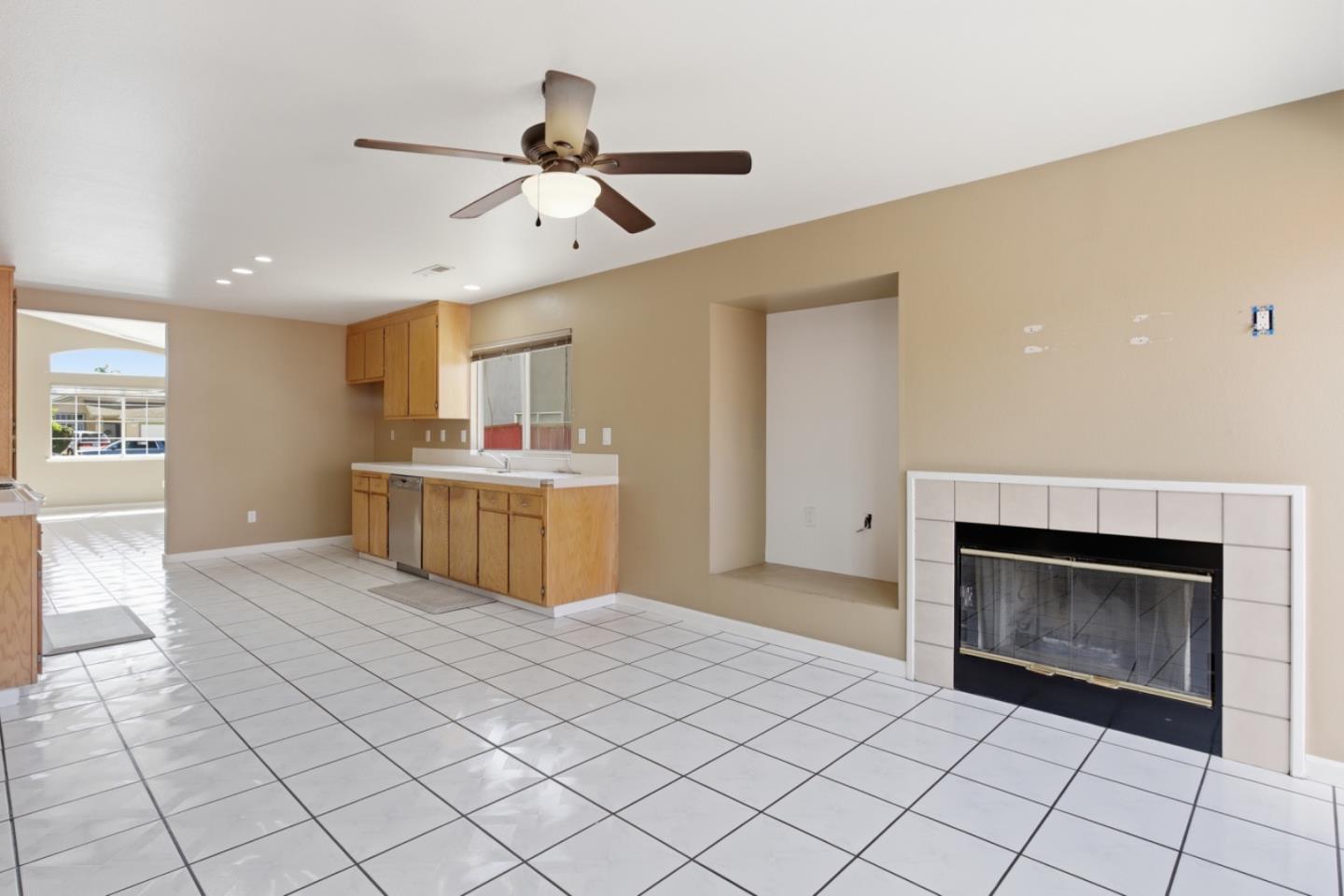 449 Sage Court Soledad, CA 93960 - Photo 8 of 17 a kitchen with stainless steel appliances a stove a sink and a fireplace