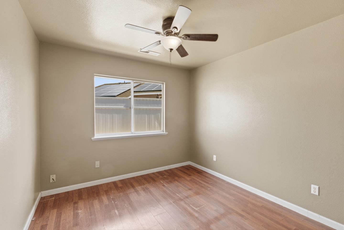 449 Sage Court Soledad, CA 93960 - Photo 10 of 17 an empty room with a window and a ceiling fan