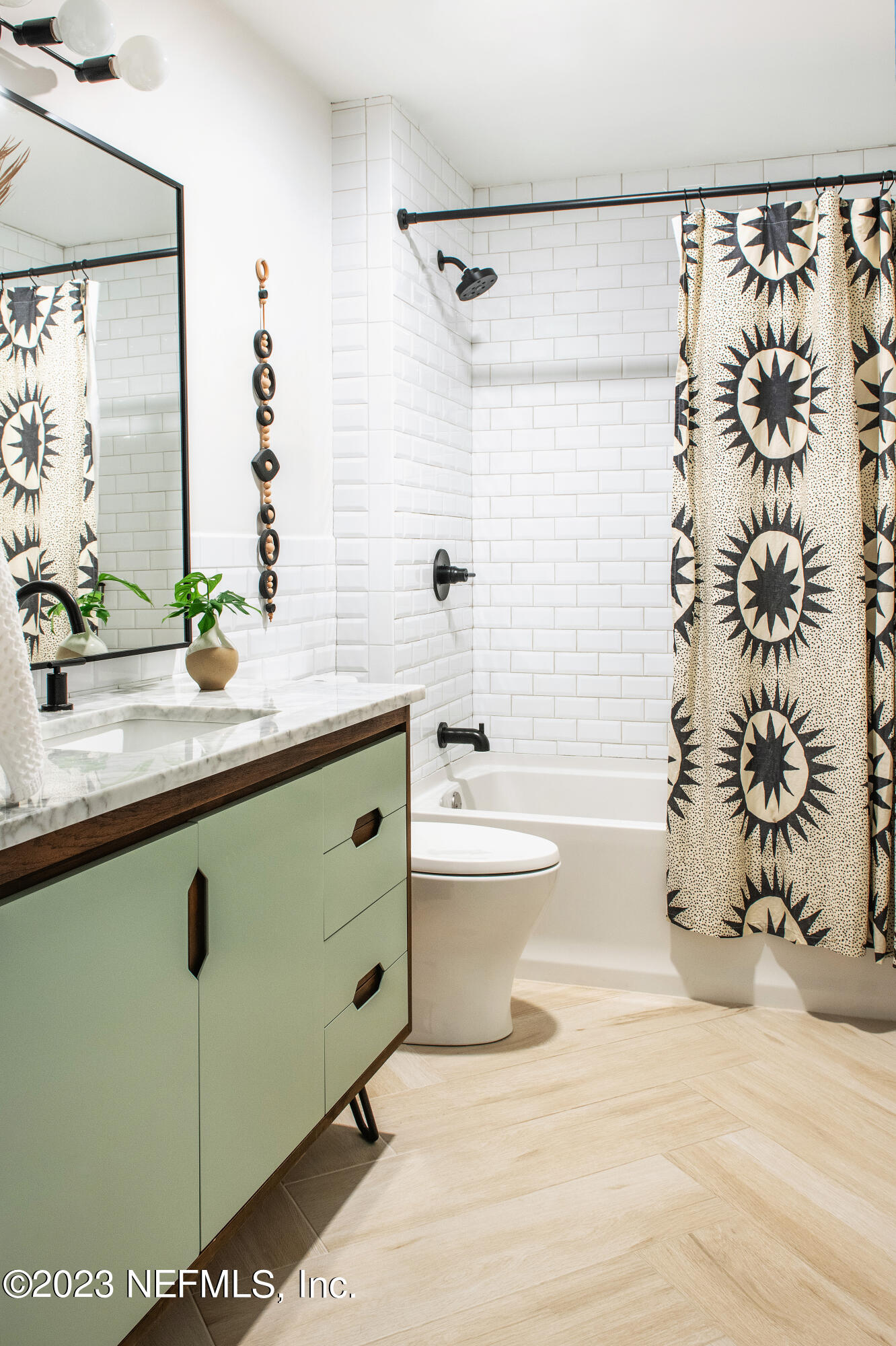 962 Ocean Boulevard Atlantic Beach, FL 32233 - Photo 11 of 63 a bathroom with a sink a toilet and shower