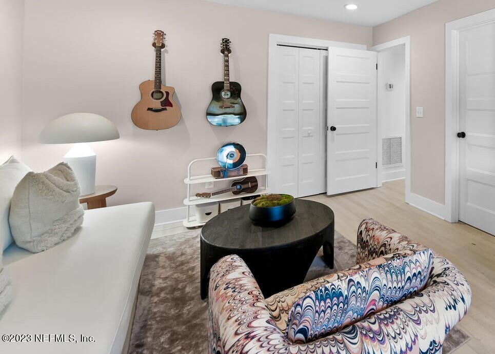 962 Ocean Boulevard Atlantic Beach, FL 32233 - Photo 16 of 63 a living room with furniture and two wooden floor