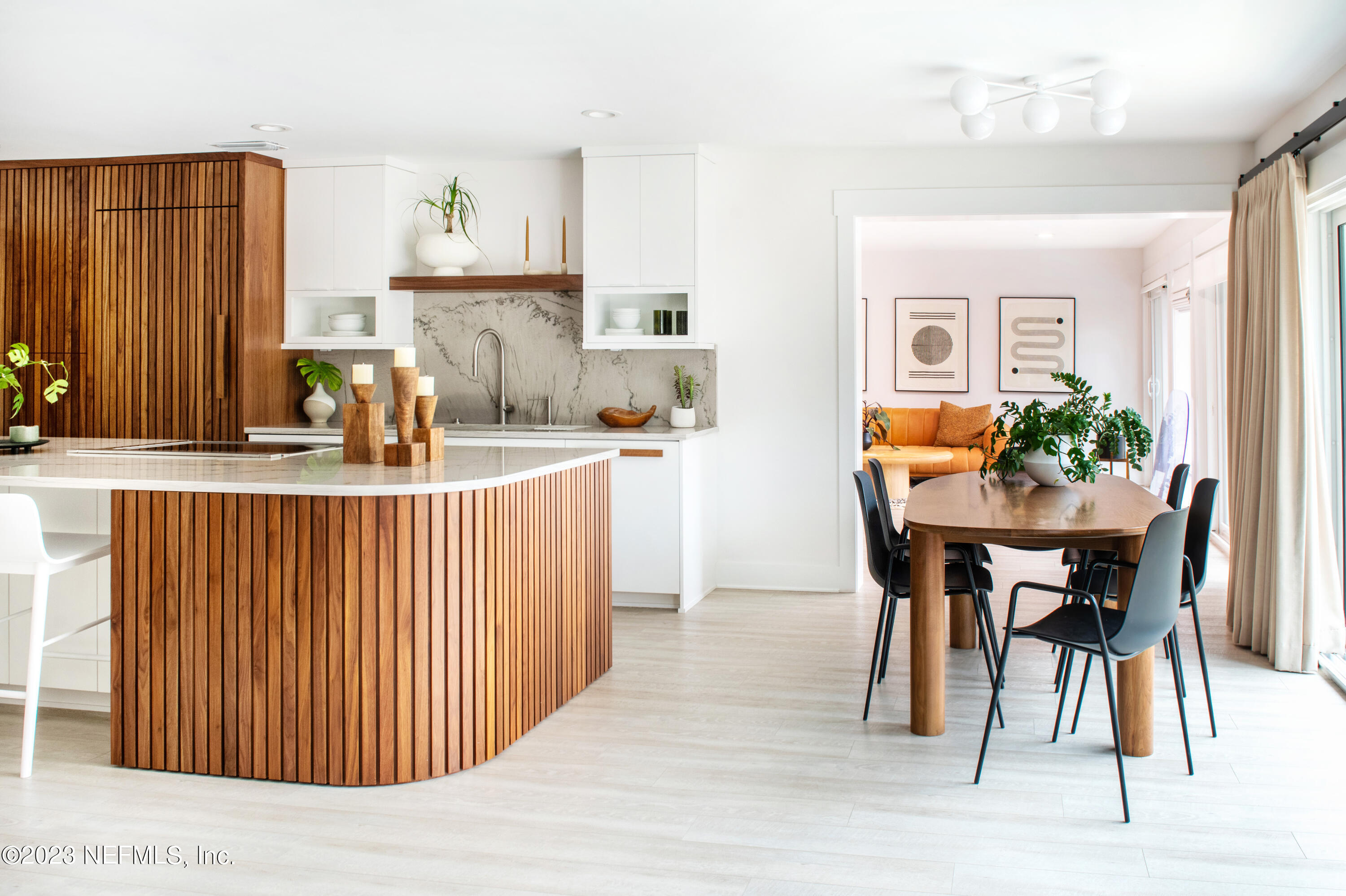 962 Ocean Boulevard Atlantic Beach, FL 32233 - Photo 17 of 63 a dining room with furniture and window