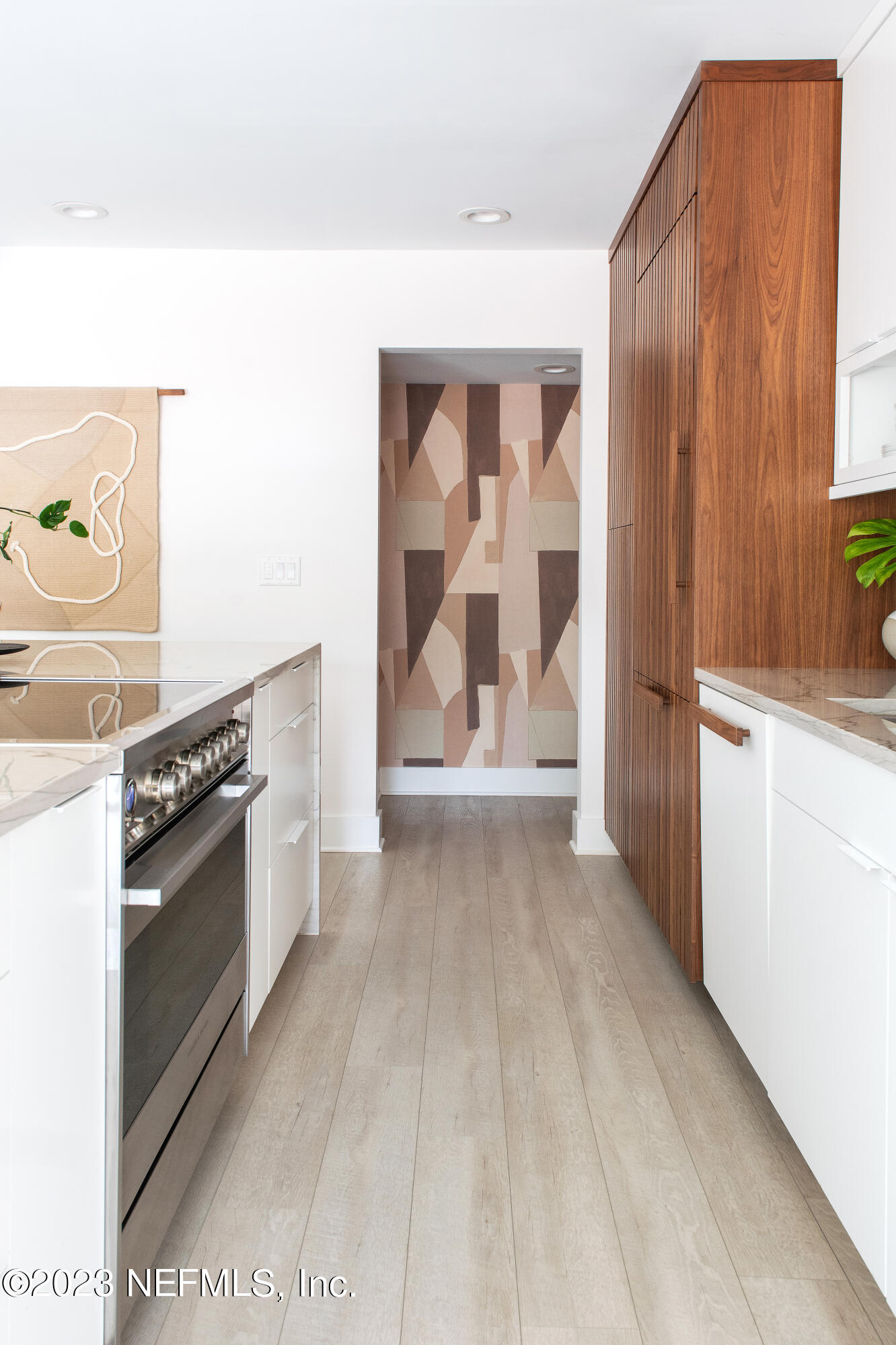 962 Ocean Boulevard Atlantic Beach, FL 32233 - Photo 20 of 63 a view of a kitchen with wooden floor and electronic appliances