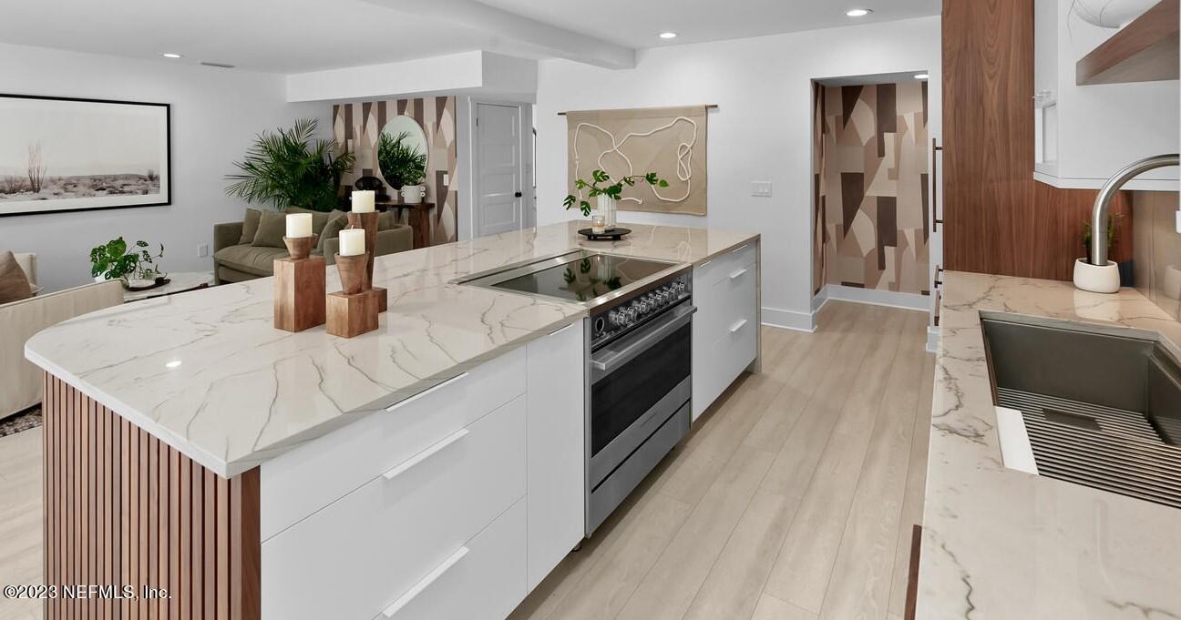 962 Ocean Boulevard Atlantic Beach, FL 32233 - Photo 23 of 63 a kitchen with stainless steel appliances granite countertop a sink dishwasher stove and oven