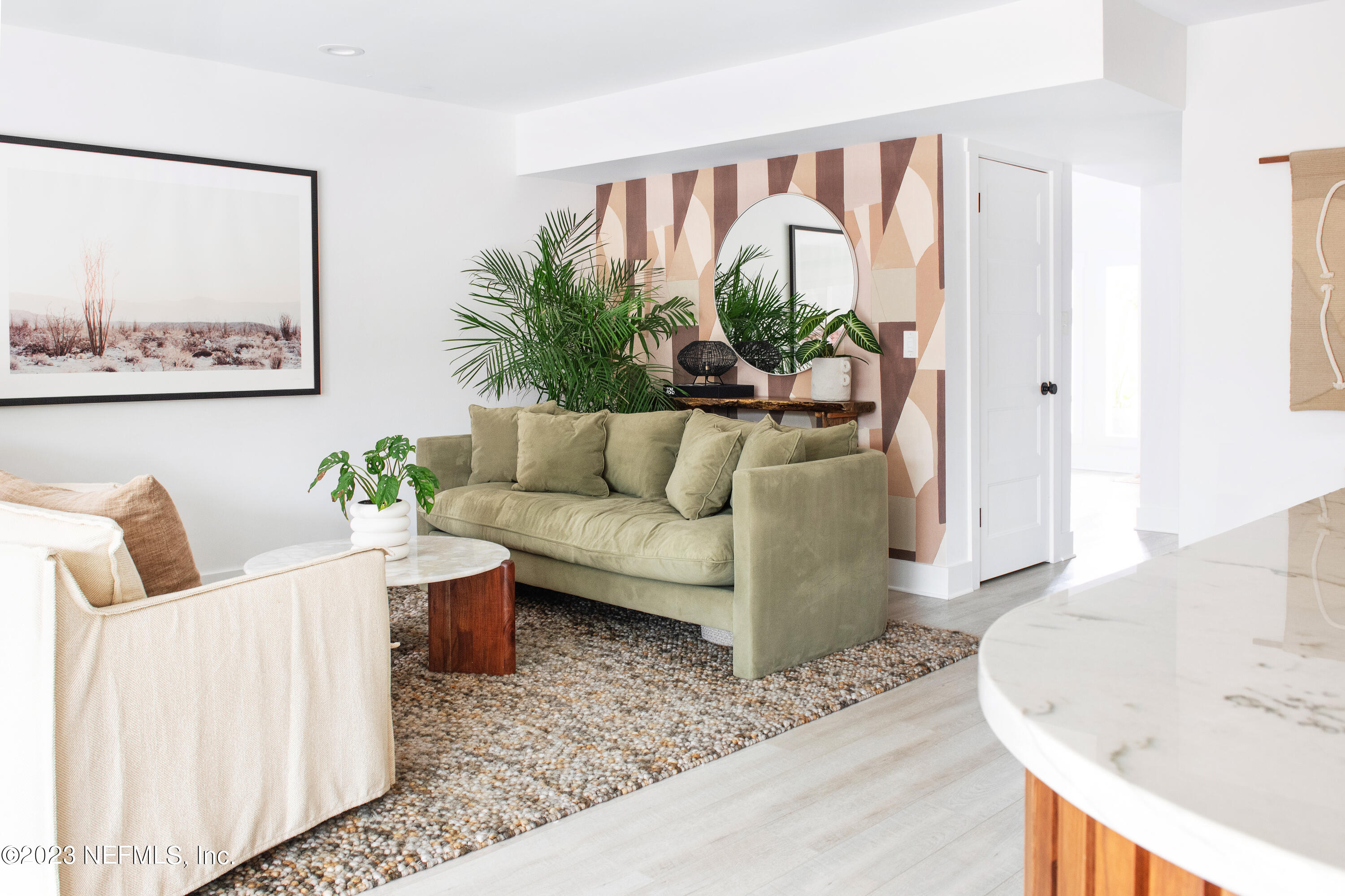 962 Ocean Boulevard Atlantic Beach, FL 32233 - Photo 27 of 63 a living room with furniture and a large window