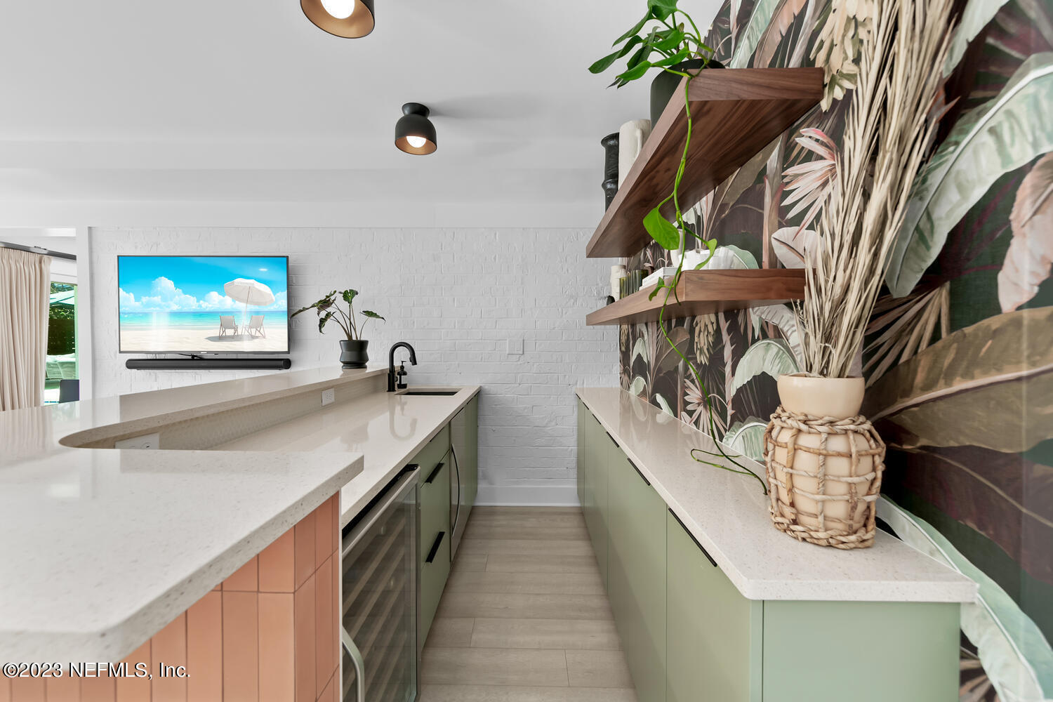 962 Ocean Boulevard Atlantic Beach, FL 32233 - Photo 28 of 63 a kitchen with stainless steel appliances granite countertop a sink a stove and a wooden floors
